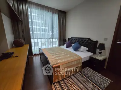 Cozy bedroom with elegant decor and large window view