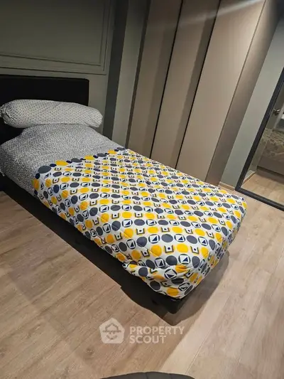 Cozy bedroom with modern design and stylish bedding in a contemporary apartment.
