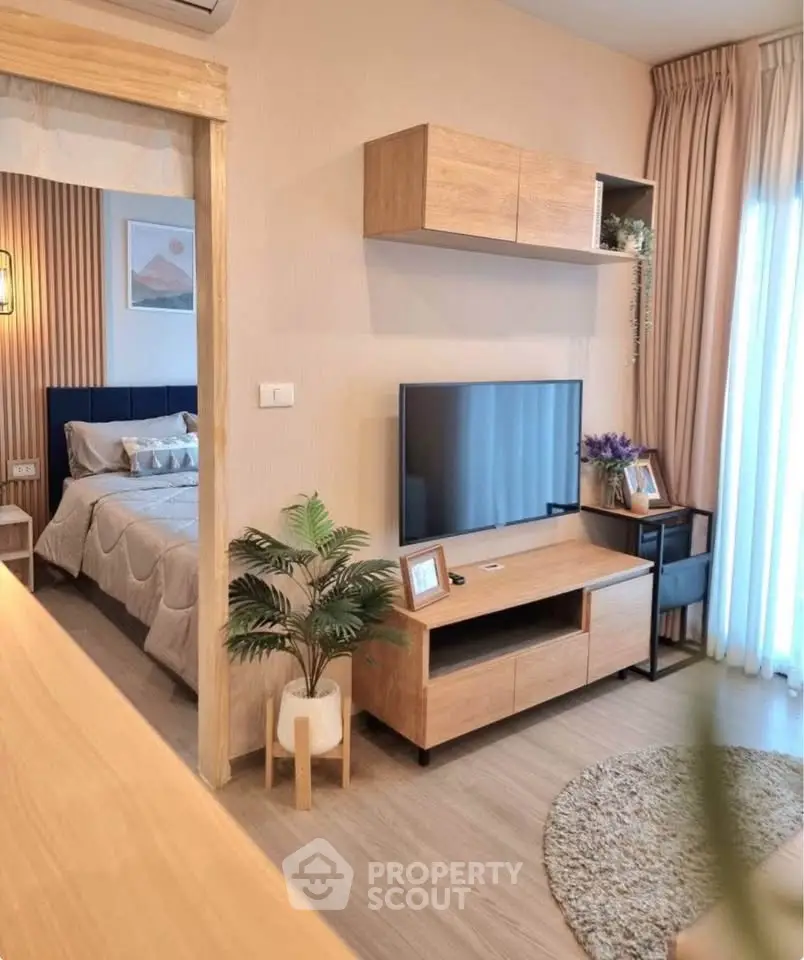 Modern living room with stylish wooden furniture and cozy bedroom view