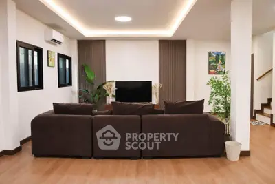 Spacious modern living room with stylish decor and comfortable seating