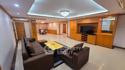 Spacious living room with modern furniture and elegant lighting