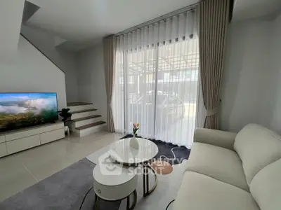 Modern living room with elegant decor and natural light