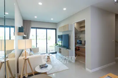 Modern living room with open study area and natural light