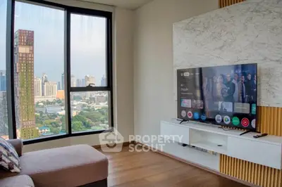 Modern living room with panoramic city view and stylish TV setup