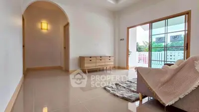 Spacious living room with modern decor and large windows for natural light.