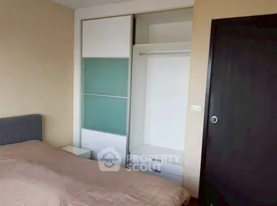 Cozy bedroom with modern sliding wardrobe and neutral decor