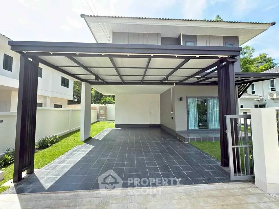 Modern two-story house with spacious carport and sleek design