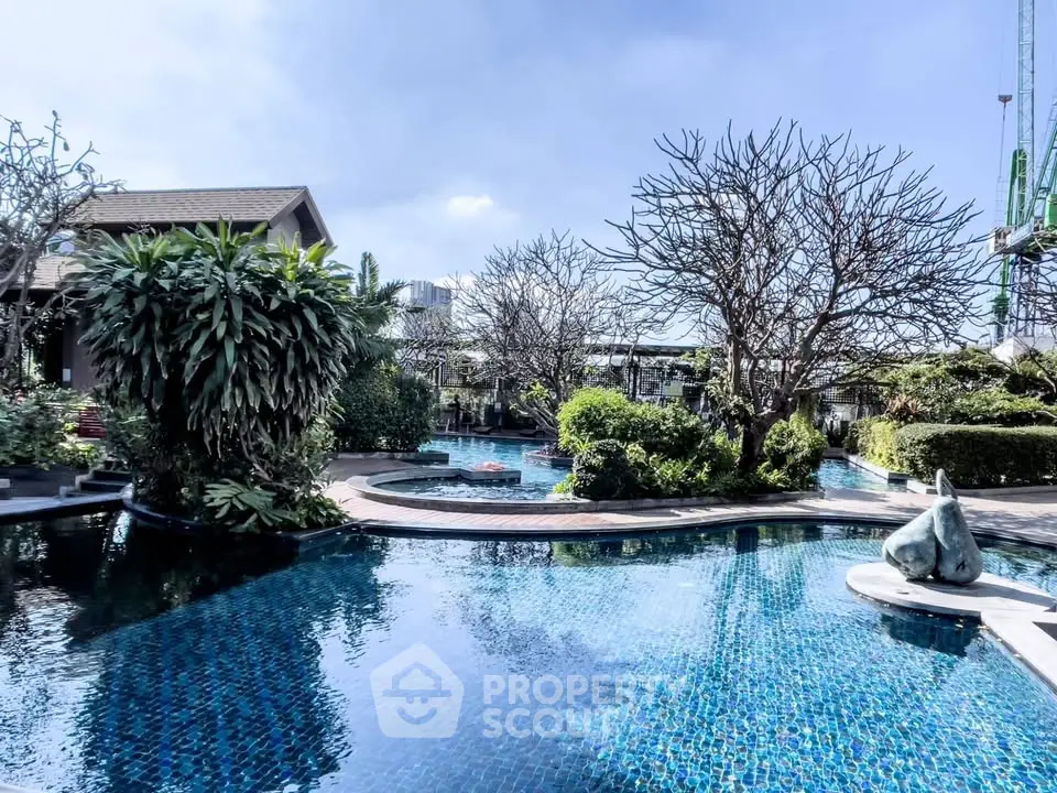 Luxurious outdoor pool area with lush greenery and serene ambiance, perfect for relaxation and leisure.