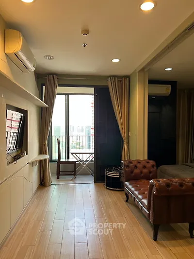 Modern living room with balcony view and stylish furniture in urban apartment