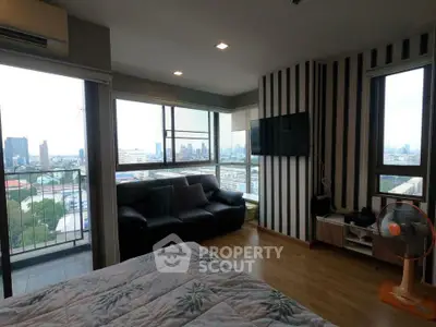 Modern bedroom with city view and stylish decor in high-rise apartment