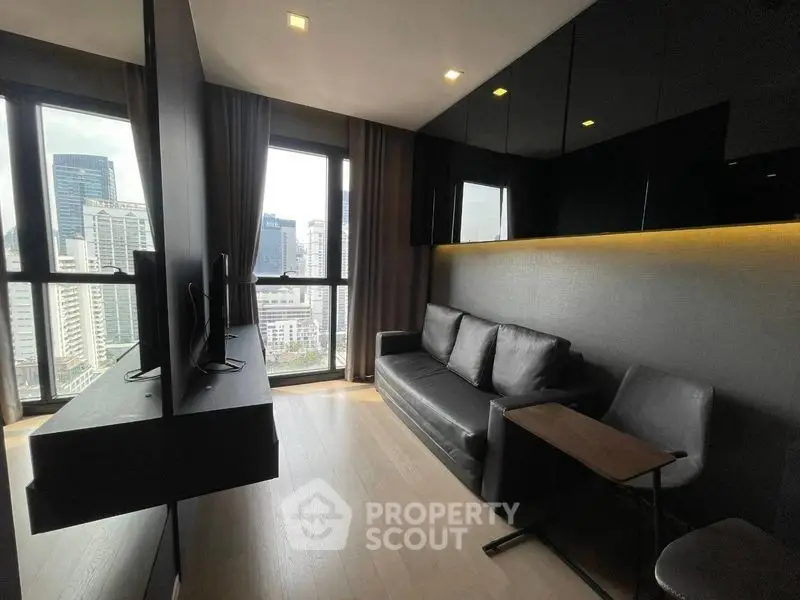 Modern living room with city view, sleek furniture, and large windows in a high-rise apartment.