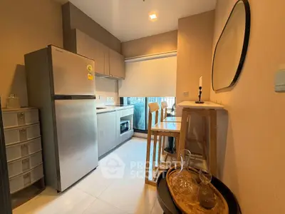 Modern kitchen with stainless steel fridge and open layout design