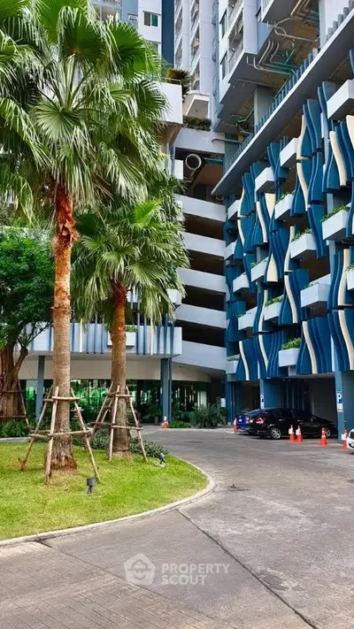 Modern architectural building with unique facade and lush landscaping
