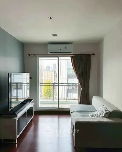 Modern living room with balcony view in urban apartment