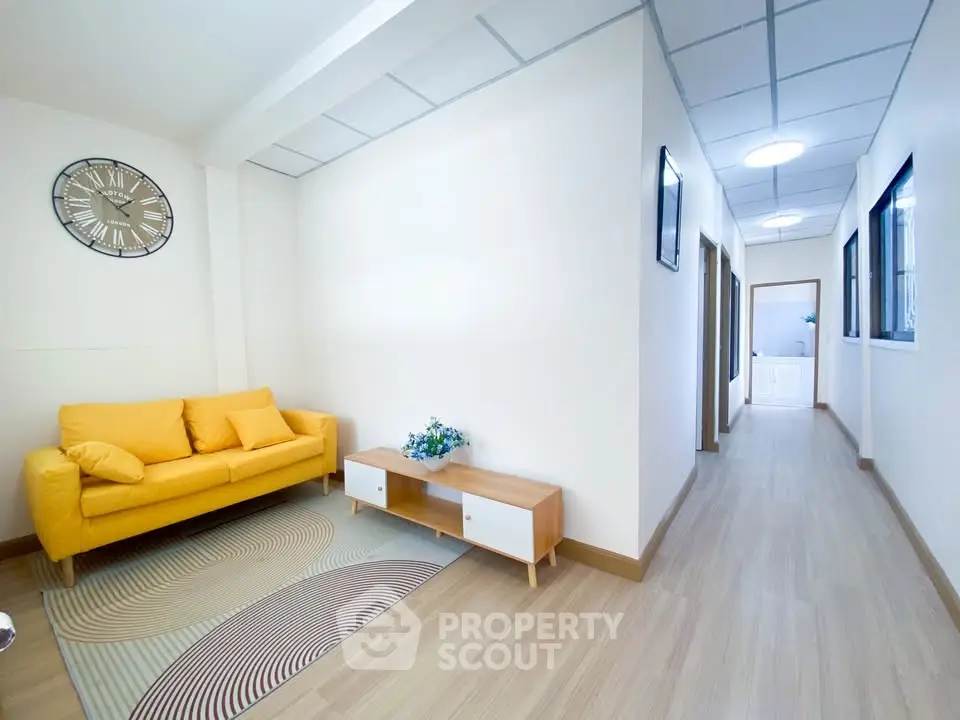 Bright living room with yellow sofa and modern decor in a cozy apartment