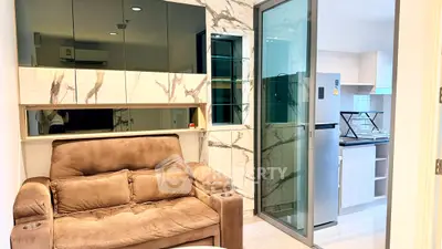 Modern living room with marble accents and open kitchen layout