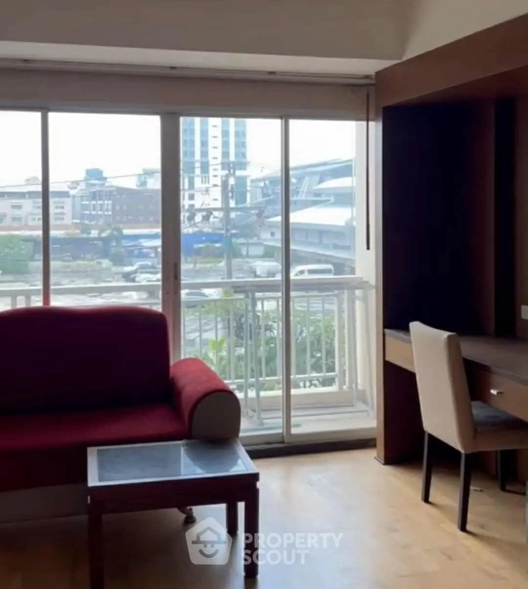 Chic urban living room with balcony view and modern furniture