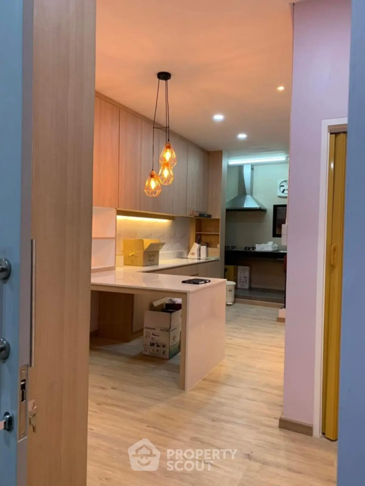 Modern kitchen with open layout and stylish pendant lights