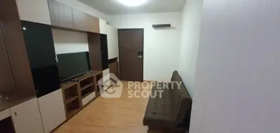Modern living room with sleek wooden furniture and cozy sofa, perfect for relaxation and entertainment.