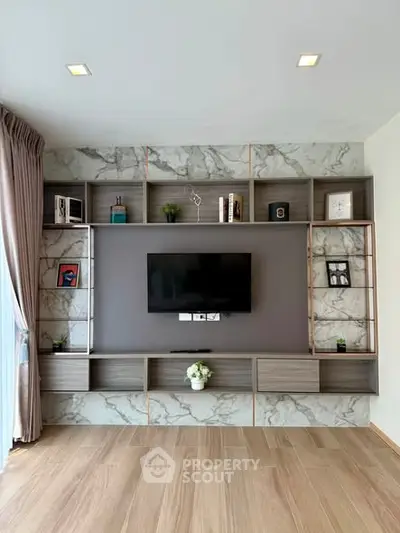 Modern living room with stylish TV wall unit and elegant decor