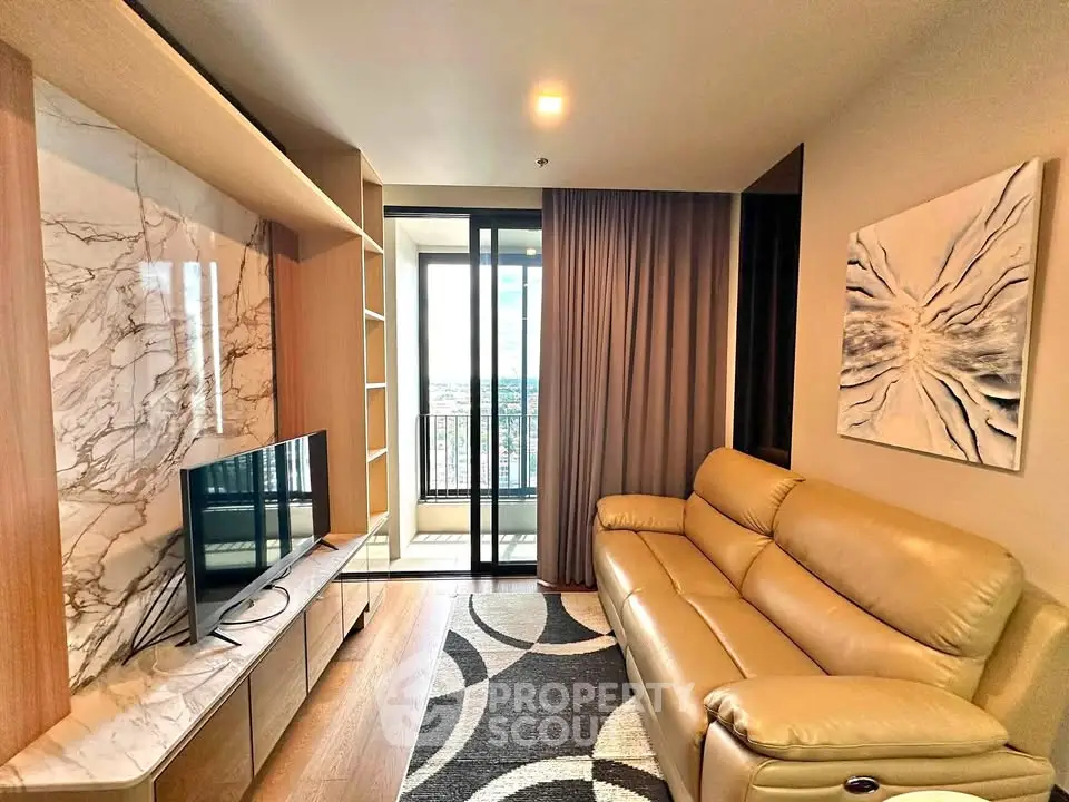 Modern living room with marble accent wall and cozy leather sofa, featuring a balcony with city view.