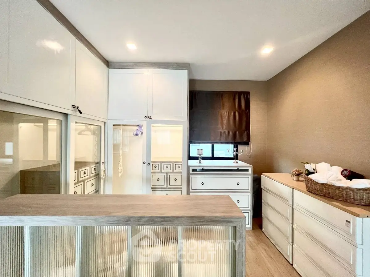 Spacious storage room with elegant cabinetry and modern design