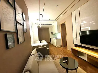 Modern living room with stylish decor and open kitchen layout in a contemporary apartment.