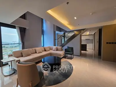 Luxurious modern living room with panoramic city view and elegant furnishings.