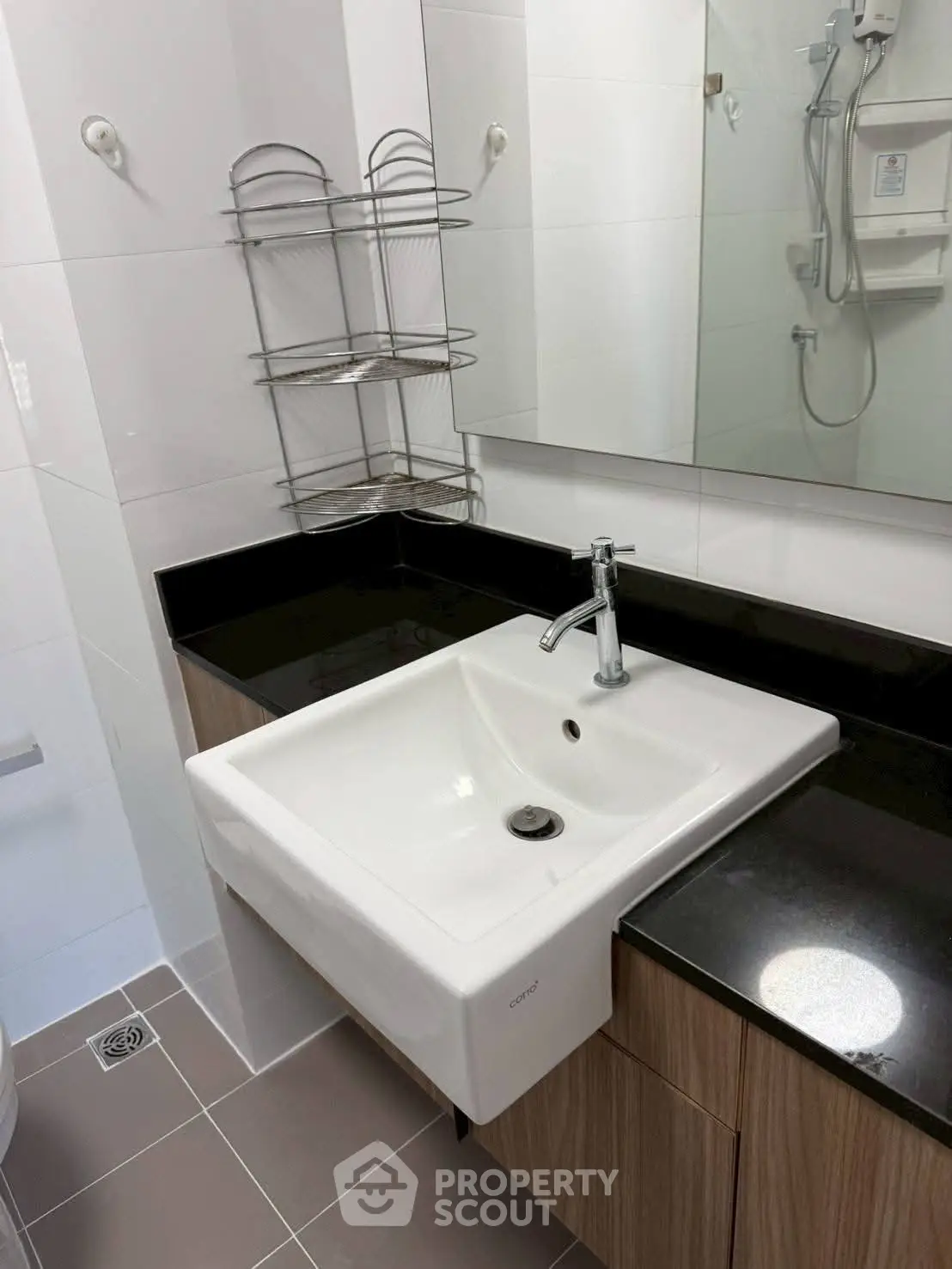Modern bathroom with sleek sink and black countertop