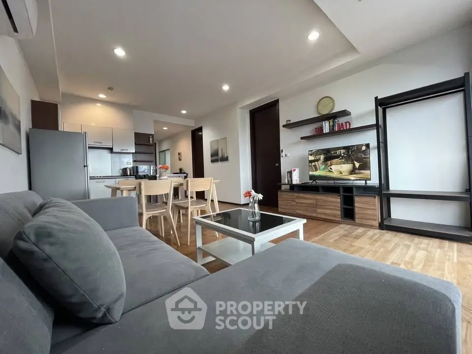 Spacious modern living room with open kitchen and stylish decor