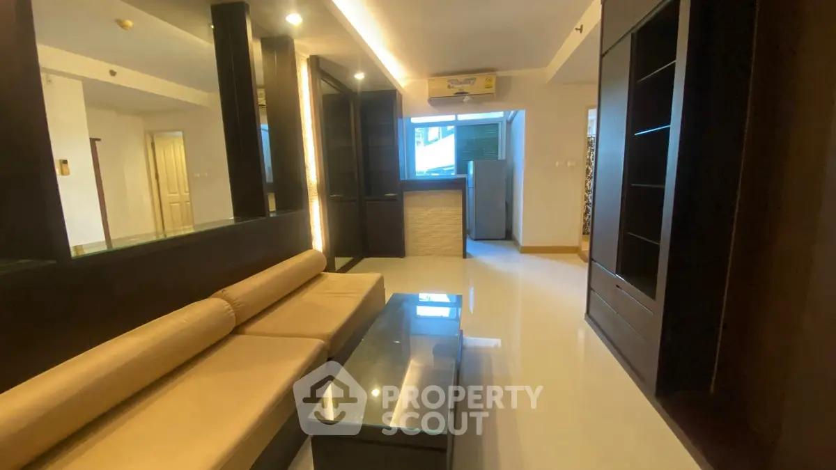 Modern living room with sleek furniture and ambient lighting