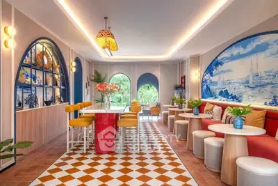 Stylish modern living room with vibrant decor and unique wall art, perfect for entertaining.