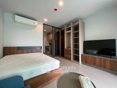 Modern studio apartment with open layout and sleek furnishings