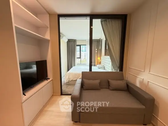 Modern apartment with cozy living room and stylish bedroom view