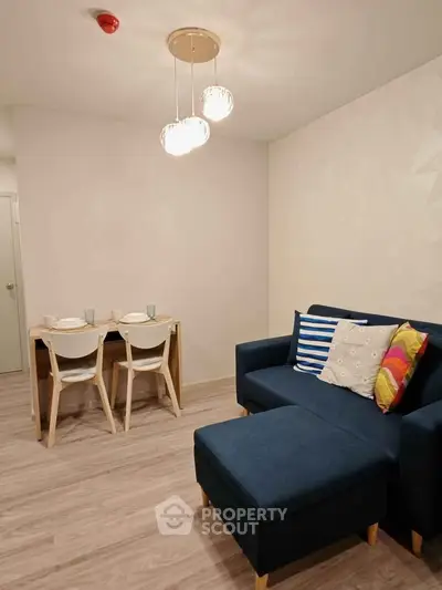 Modern living room with stylish furniture and cozy dining area