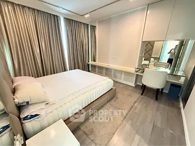 Luxurious bedroom with elegant decor and ample natural light