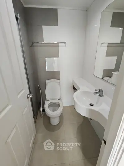 Modern compact bathroom with sleek design and neutral tones
