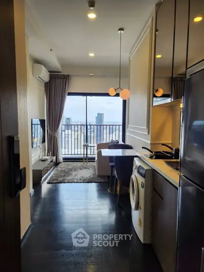 Modern apartment interior with open kitchen and city view, featuring sleek appliances and stylish decor.