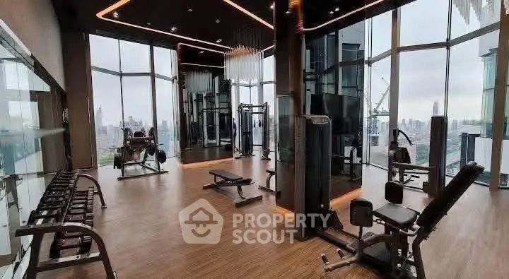 Luxurious high-rise gym with panoramic city views and modern equipment.