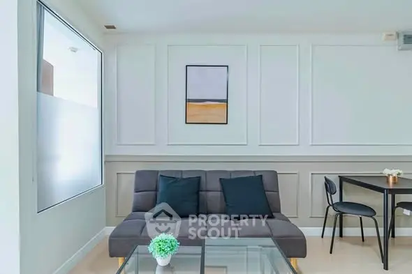 Modern living room with stylish sofa and elegant decor in a bright apartment.