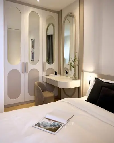 Stylish bedroom with modern wardrobe and elegant vanity area