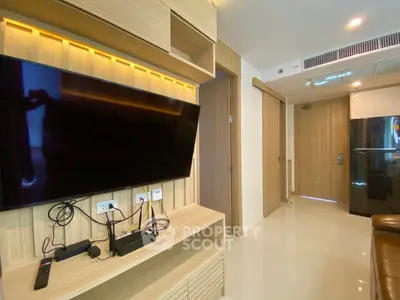 Modern living room with sleek TV setup and stylish wooden cabinetry