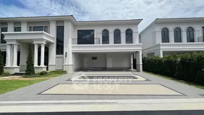 Luxurious modern mansion with grand entrance and spacious driveway