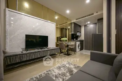 Luxurious modern living room with marble accents and open kitchen layout