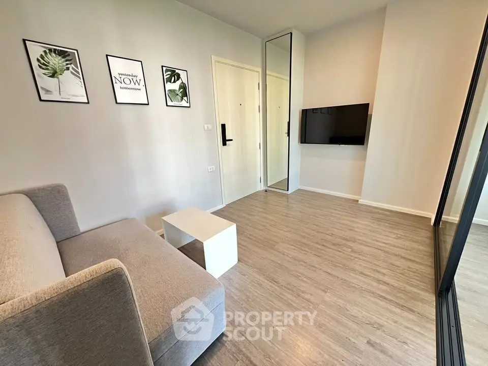 Modern living room with sleek design and wall-mounted TV