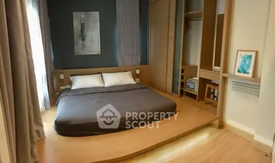 Modern bedroom with minimalist design and built-in storage solutions.