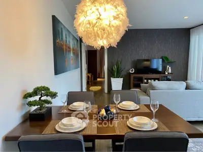 Elegant dining area with modern decor and stylish lighting in a contemporary living space.