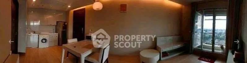Modern apartment interior with open kitchen and balcony view