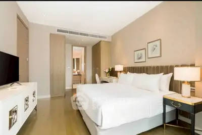 Luxurious bedroom with elegant decor and modern furnishings in a stylish apartment.