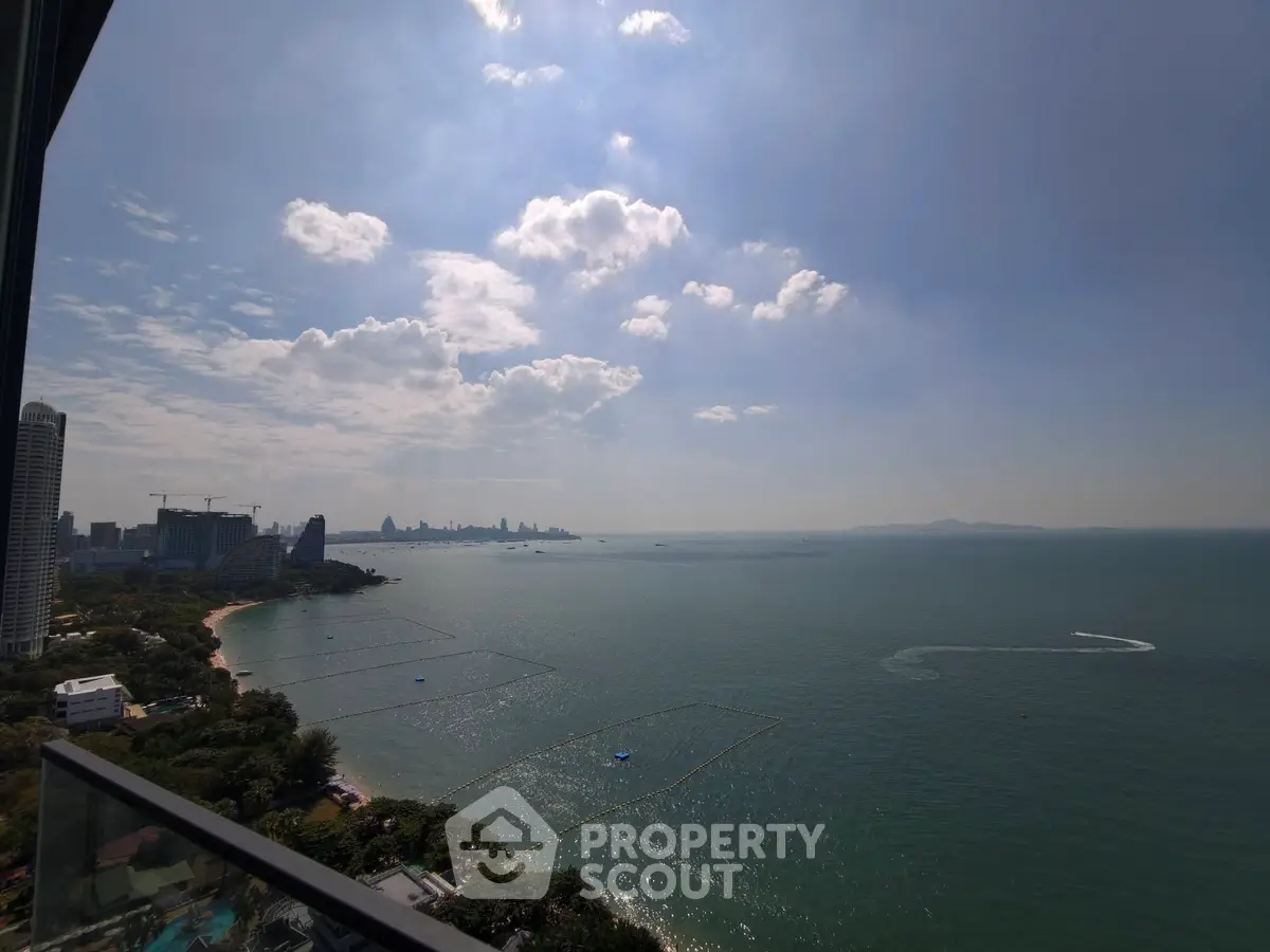 Stunning ocean view from high-rise balcony with city skyline